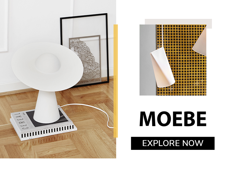 Moebe minimalist white table lamp with sculptural design, styled in a modern interior with wooden flooring and framed artwork.